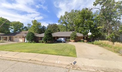 Completed residential roofing project on a brick ranch home