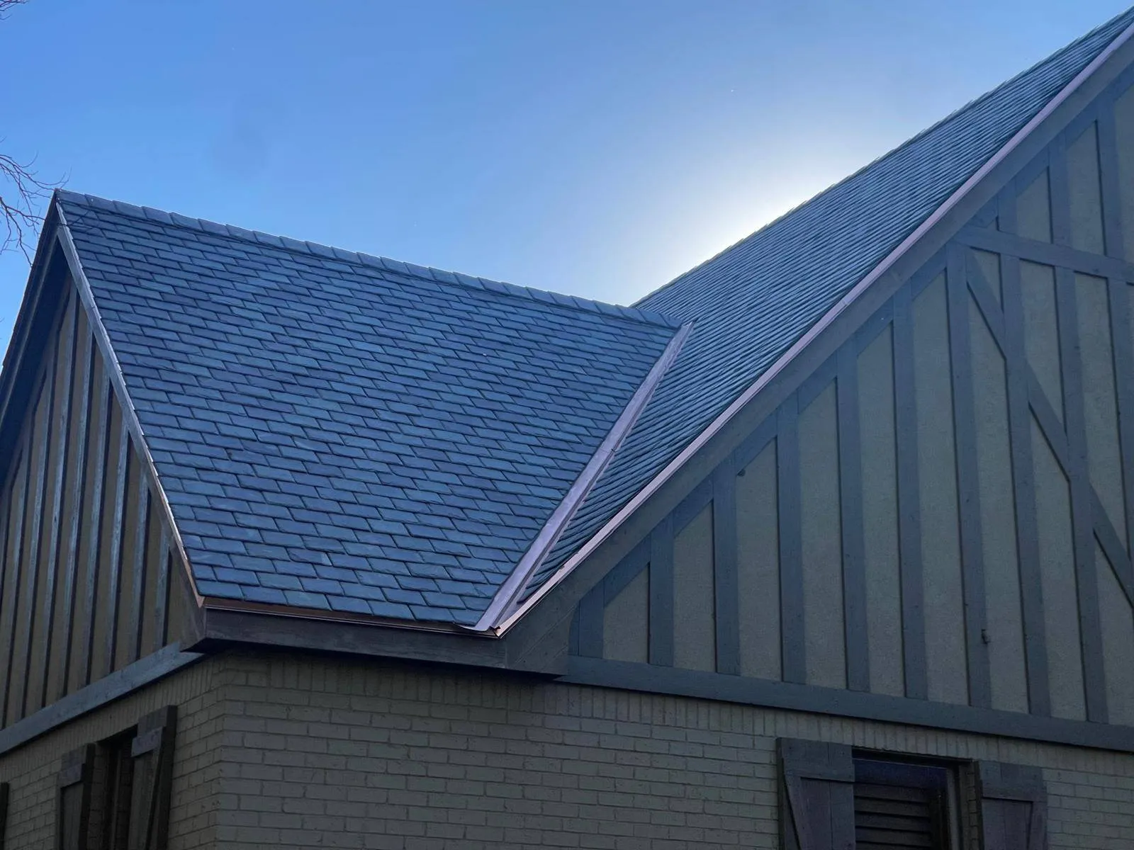 Close-up of synthetic slate roofing gable and valley detail
